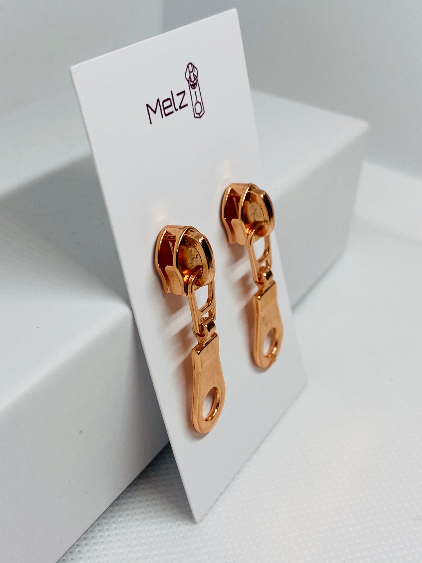 Rose gold round zipper pull earrings