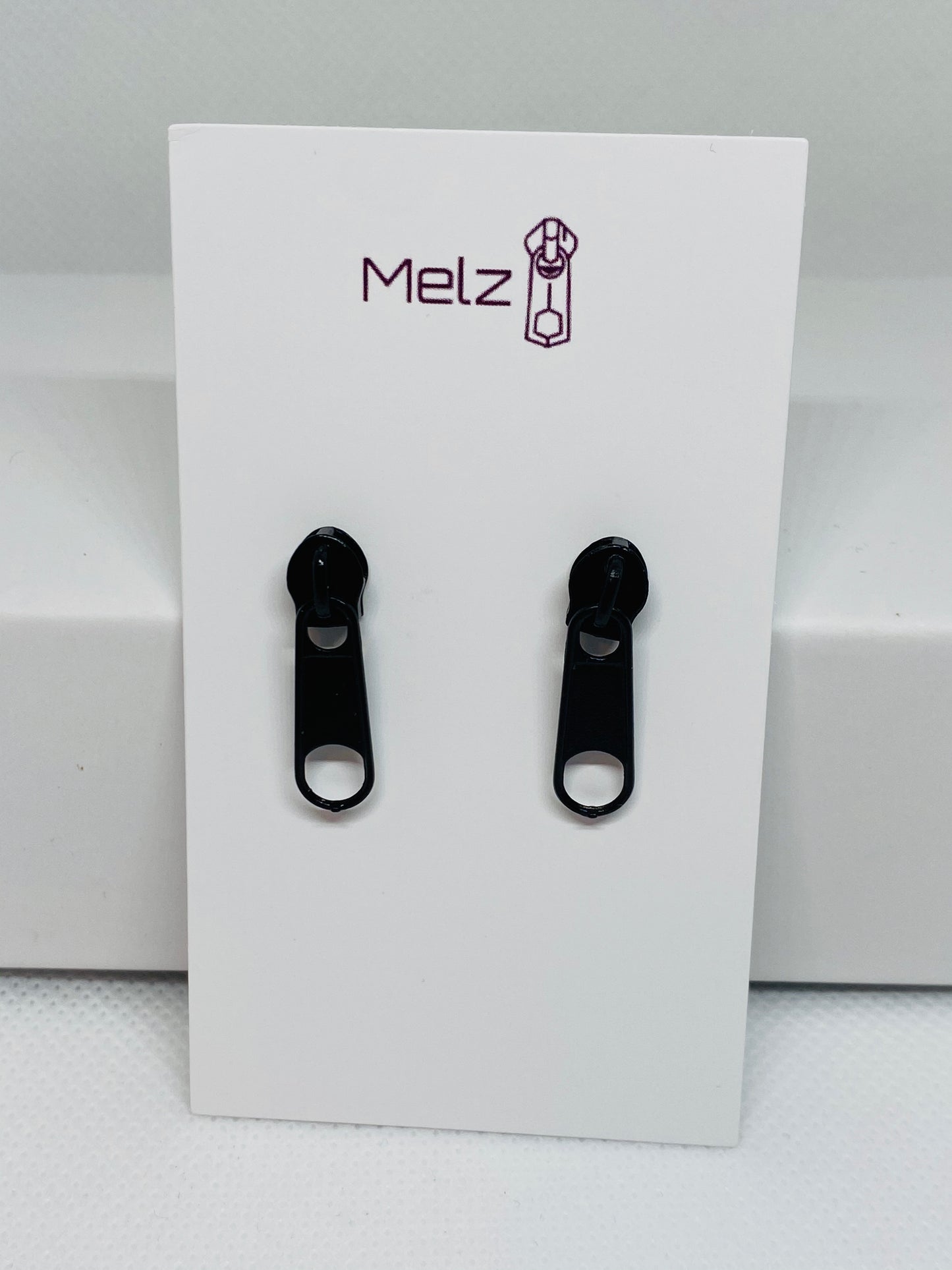 Small black zipper earring