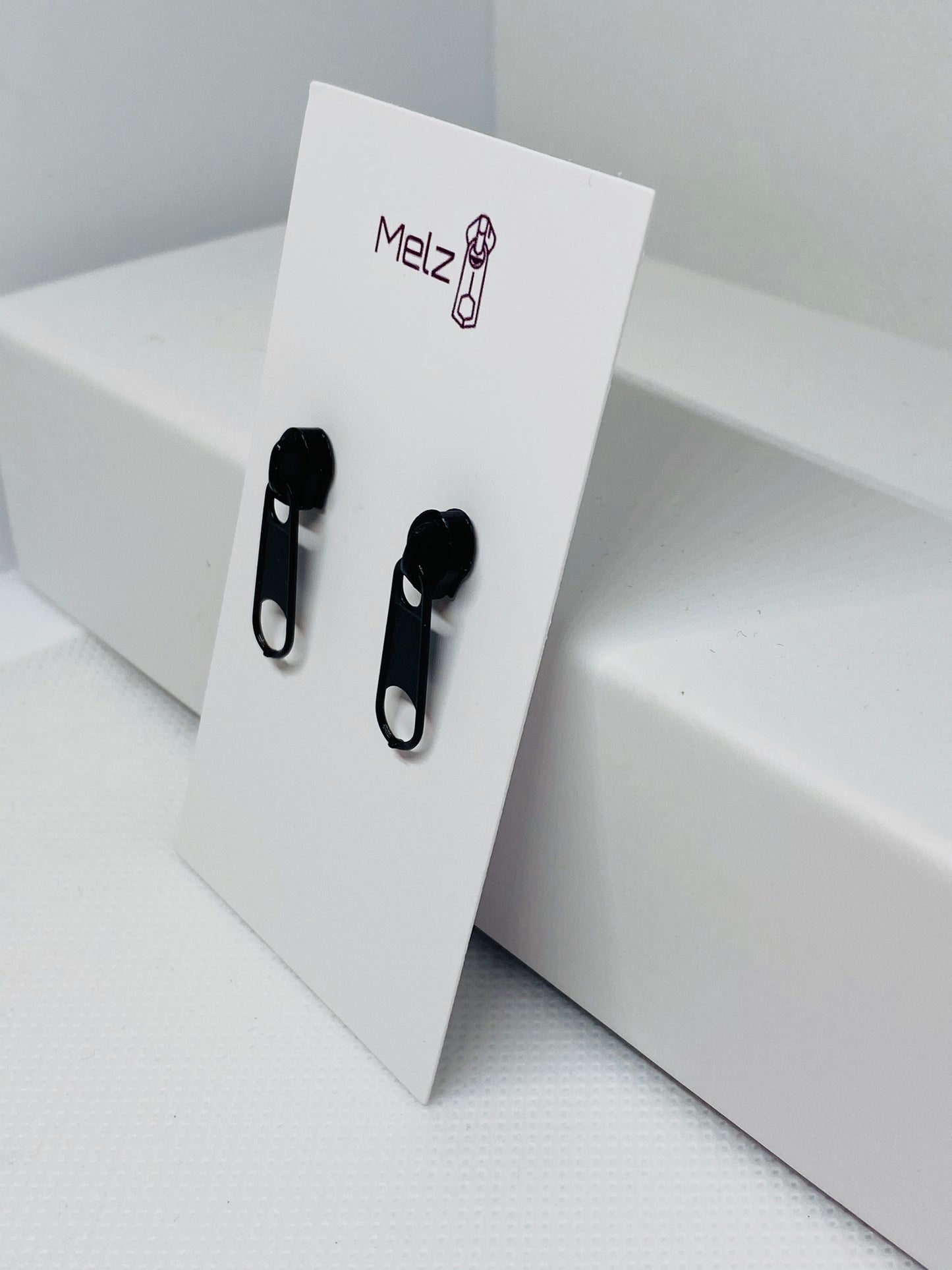 Small black zipper earring