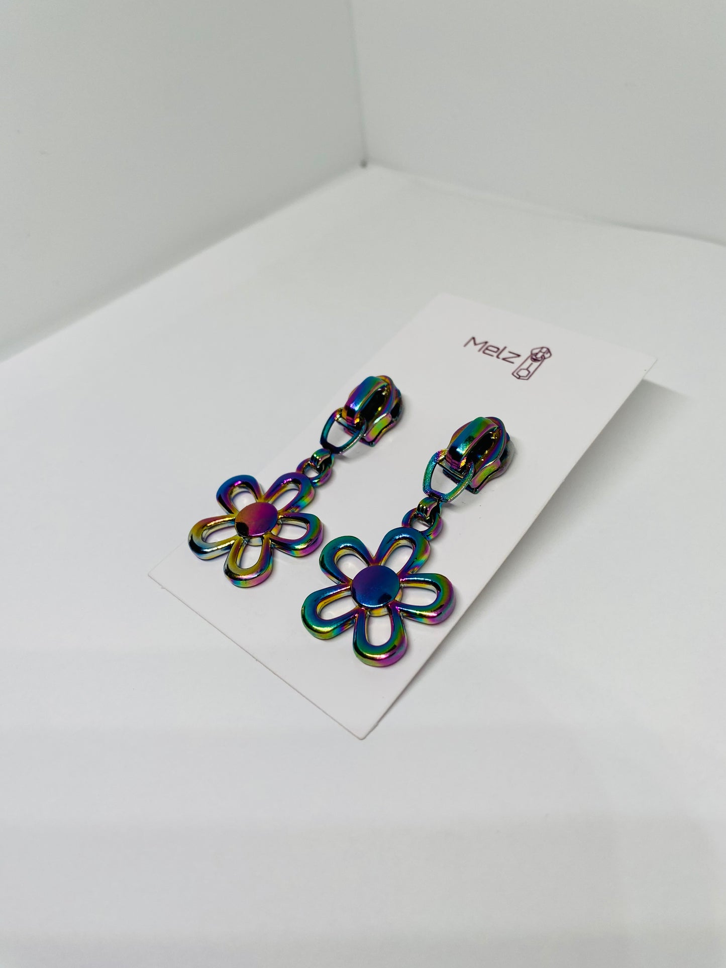 Metallic flower zipper pull earrings
